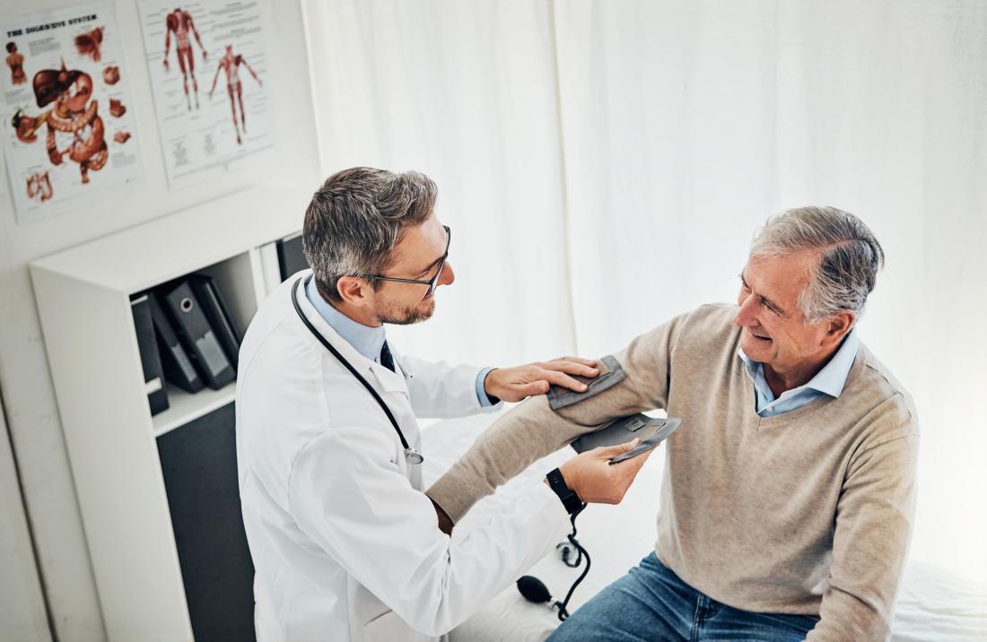 doctor taking blood pressure